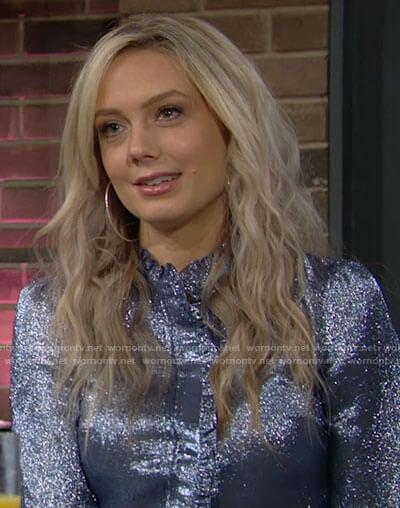 Abby's blue metallic blouse with ruffled trim on The Young and the Restless