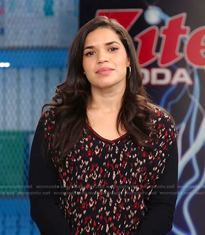 Amy’s black printed v-neck top on Superstore