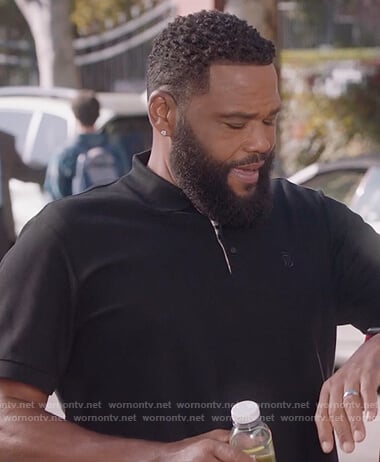 Andre's black polo shirt on Black-ish