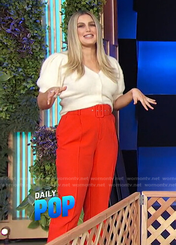 Carissa's white cardigan and red belted pants on E! News Daily Pop