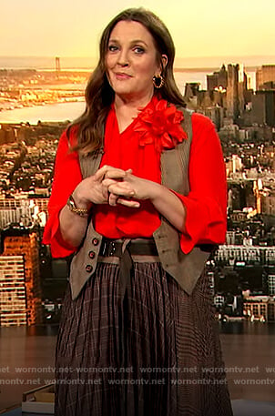 Drew’s orange tie neck blouse and plaid skirt on The Drew Barrymore Show