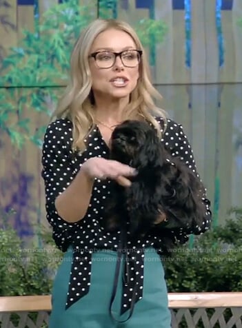 Kelly’s black polka dot blouse and green pants on Live with Kelly and Ryan