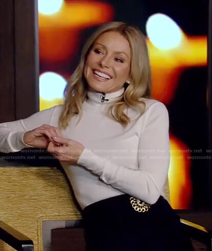Kelly’s white turtlneck sweater and black skirt on Live with Kelly and Ryan