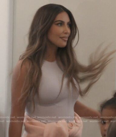 Kim’s white crew neck bodysuit on Keeping Up with the Kardashians