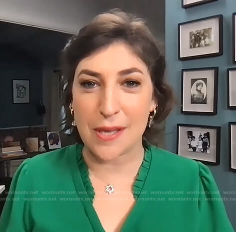 Mayim Bialik’s green ruffle neck top on The Drew Barrymore Show
