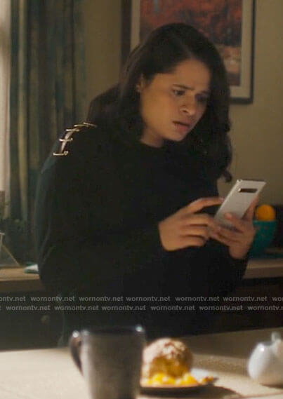Mel’s black sweater with safety pins on Charmed