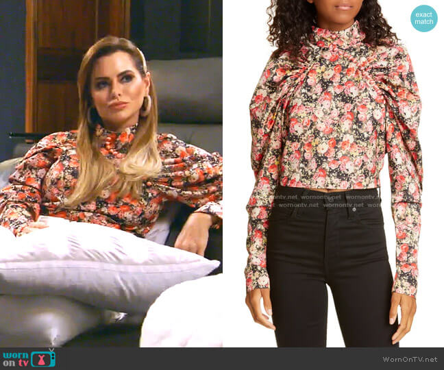 Kim Floral Puff Sleeve Crop Top by Rotate worn by D’Andra Simmons on The Real Housewives of Dallas