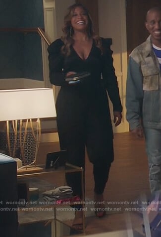 Mika’s black puff sleeve jumpsuit on Kenan