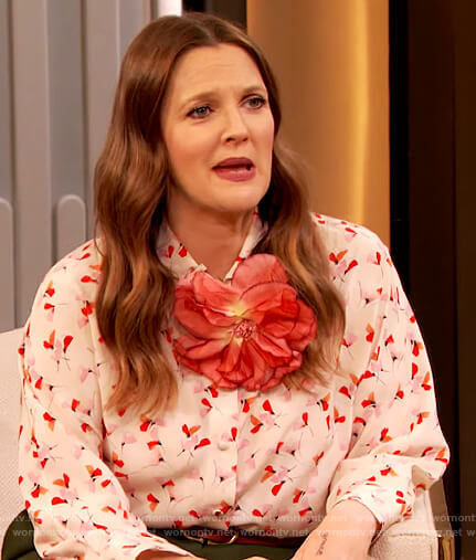 Drew's floral print blouse and green flare pants on The Drew Barrymore Show