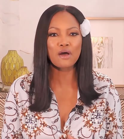 Garcelle’s blue belt print blouse on The Real