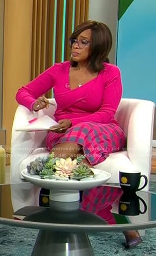 Gayle King's pink asymmetric sweater and checked skirt on CBS Mornings