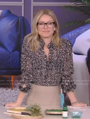 Kelly’s black printed blouse and beige skirt on Live with Kelly and Ryan