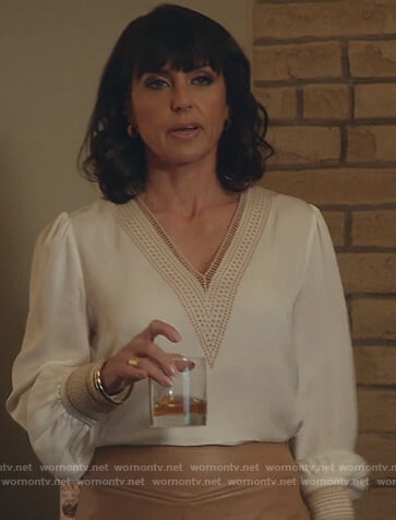 Kathleen's white eyelet trim v-neck blouse on Good Trouble