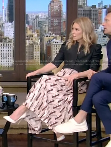 Kelly’s black puff sleeve blouse and print pleated skirt on Live with Kelly and Ryan