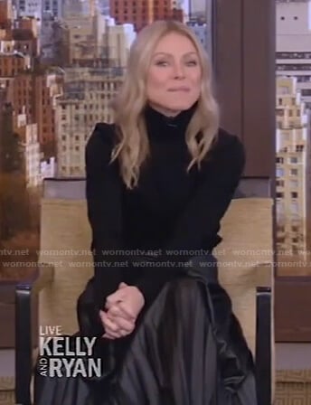 Kelly’s black turtleneck sweater and pleated skirt on Live with Kelly and Ryan