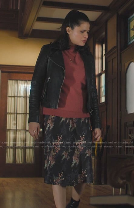 Mel’s pink sweater, leather jacket and floral skirt on Charmed