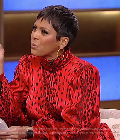 Tamron’s red leopard satin dress on Tamron Hall Show