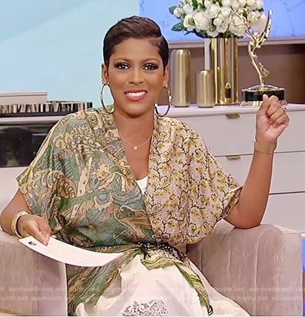 Tamron's printed wrap blouse and white lace skirt on Tamron Hall Show