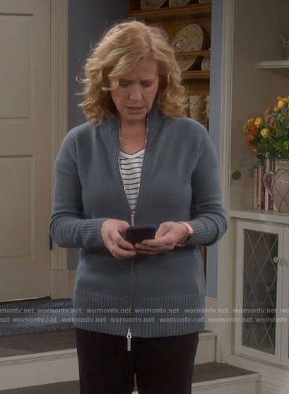 Vanessa’s blue zip up sweater on Last Man Standing