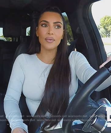 Kim's white long sleeve bodysuit on Keeping Up with the Kardashians