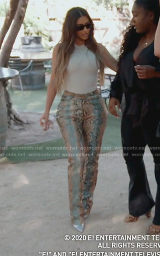 Kim’s white tank and snake skin pants on Keeping Up with the Kardashians