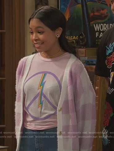 Nia’s pink peace sign sweatshirt on Ravens Home