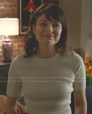 Taylor’s white ribbed buttoned shoulder top on Bull