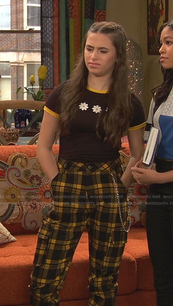 Tess's brown floral tee and yellow plaid pants on Ravens Home
