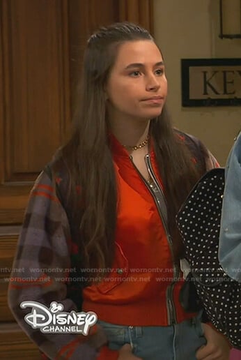 Tess's orange plaid-sleeve bomber jacket on Ravens Home