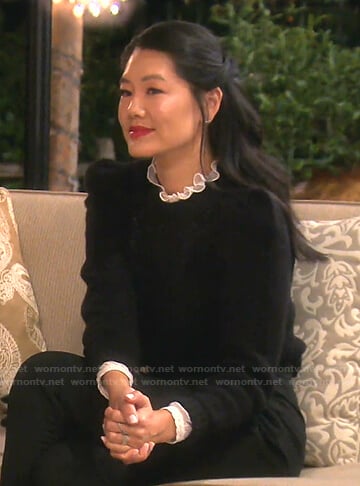 Crystal's white ruffle neck blouse and black sweater on The Real Housewives of Beverly Hills