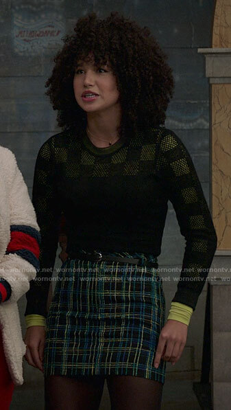 Gina’s black checkerboard sweater and tweed skirt on High School Musical The Musical The Series
