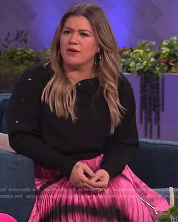 Kelly’s black button embellished sweater and tie dye skirt on The Kelly Clarkson Show