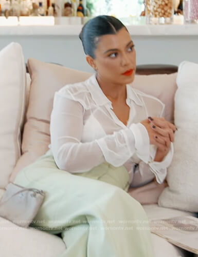 Kourtney’s white sheer blouse and green pants on Keeping Up with the Kardashians