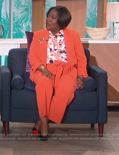 Sheryl’s floral tie neck blouse and blazer on The Talk