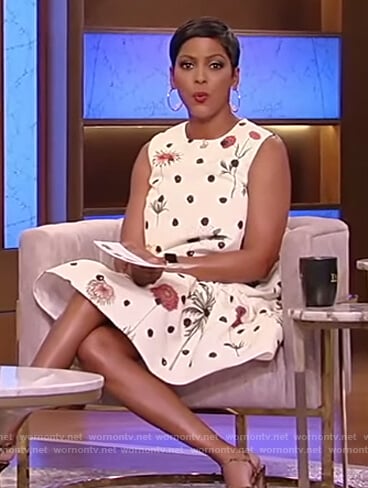 Tamron’s white sleeveless floral dress on Tamron Hall Show