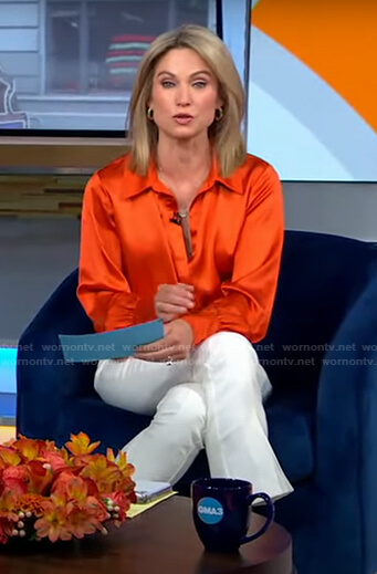 Amy's orange blouse and white cropped pants on Good Morning America