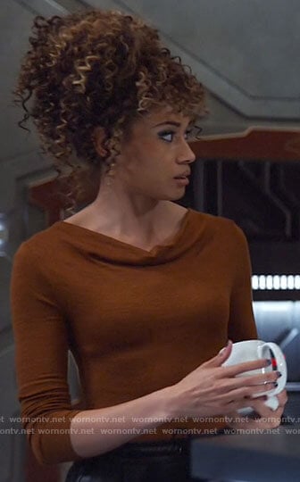 Astra's tan cowl neck top on Legends of Tomorrow