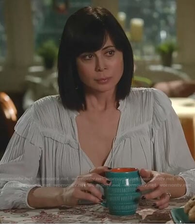 Cassie’s light grey pleated tie neck blouse on Good Witch