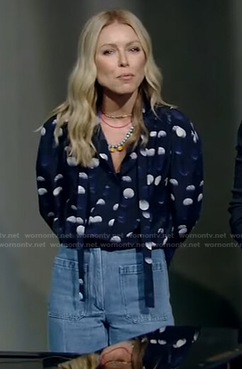 Kelly’s blue polka dot tie neck blouse and jeans on Live with Kelly and Ryan