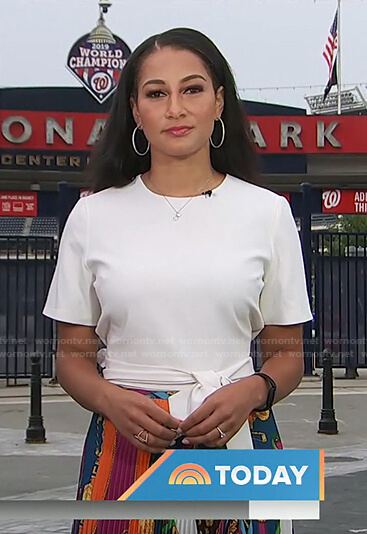 Morgan Radford’s white top and mixed print pleated skirt on Today