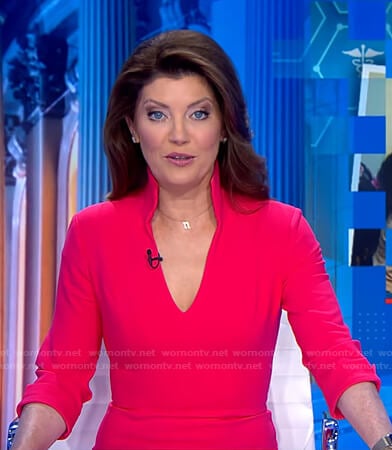 Norah’s pink stand collar v-neck dress on CBS Evening News