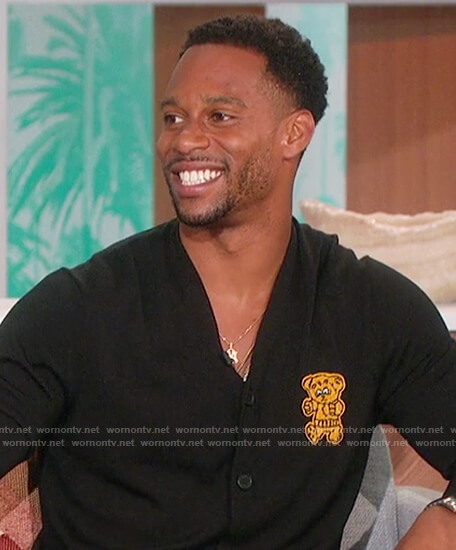 Victor Cruz’s black teddy embroidered cardigan on The Talk