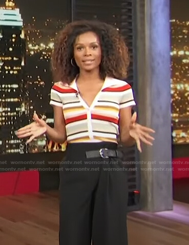 Zuri's striped polo and black belted pants on Access Hollywood