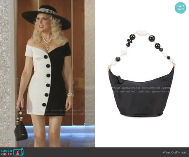 Gia shoulder bag by Cult Gaia worn by Alexis Carrington (Elaine Hendrix) on Dynasty