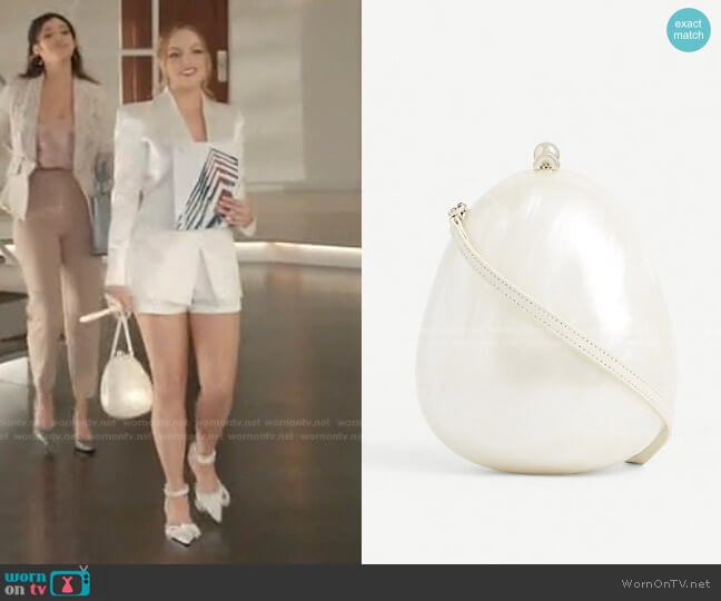 Pearlescent Egg Cross-Body Bag by Simone Rocha worn by Fallon Carrington (Elizabeth Gillies) on Dynasty