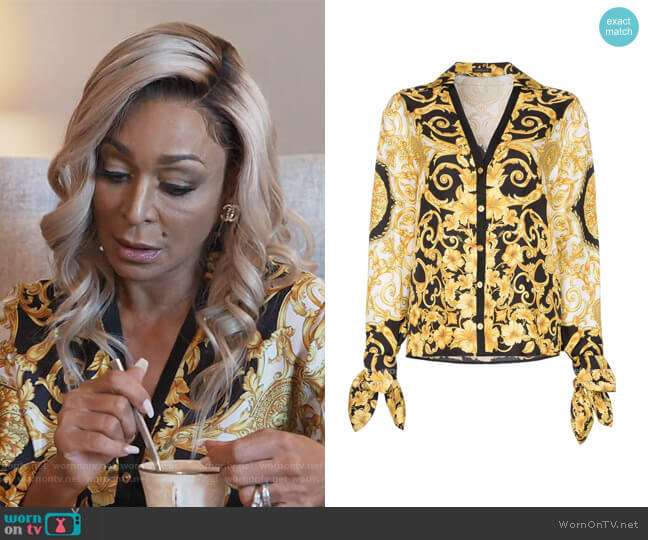 V-neck Baroque-print blouse by Versace worn by Karen Huger on The Real Housewives of Potomac