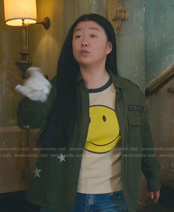 Alice's beige smiley face tee and green star jacket on Good Trouble