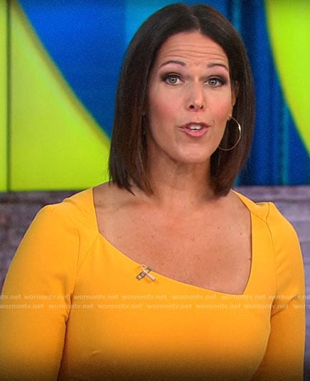 Dana Jacobson’s orange dress with asymmetric neckline on CBS This Morning