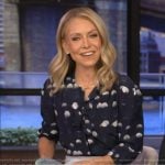 Kelly’s navy dotted tie neck blouse on Live with Kelly and Ryan