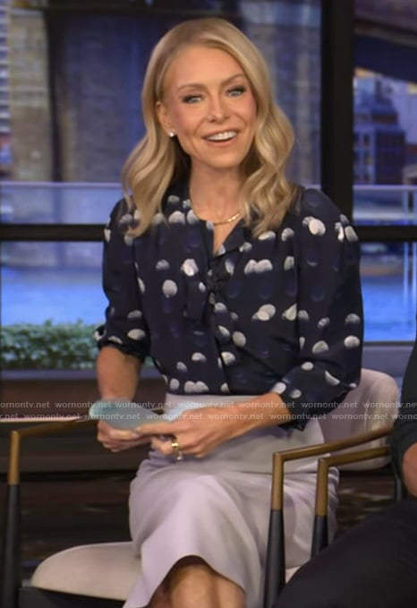 Kelly's navy dotted tie neck blouse on Live with Kelly and Ryan